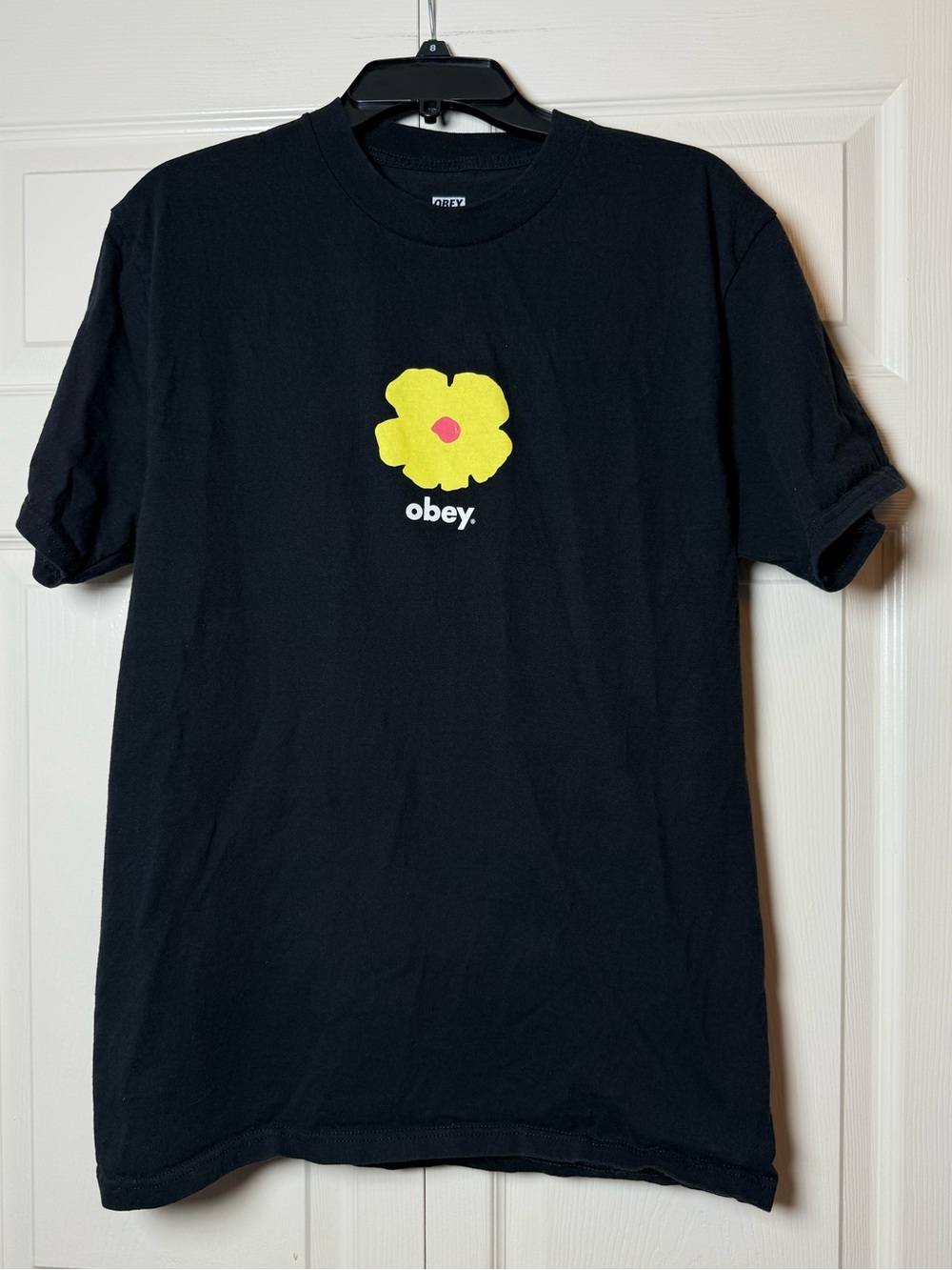 Obey T-shirt with yellow flower graphic‎